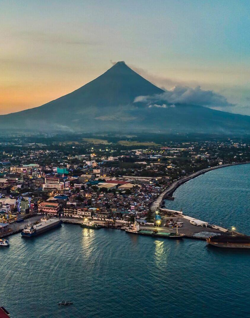 Photograph of Mount Mayon overlooking the port in Legazpi City